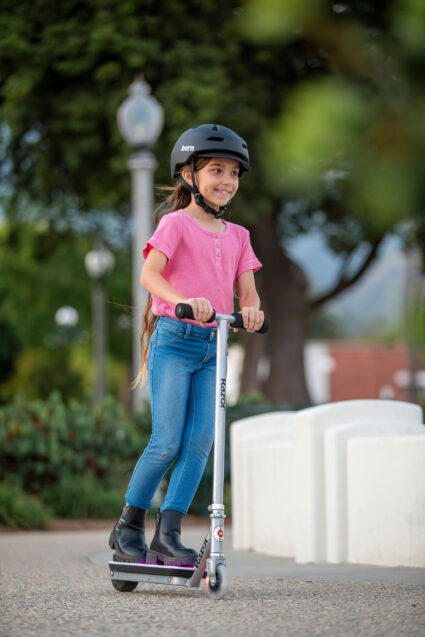 Color Rave Electric Scooter ridden at a park